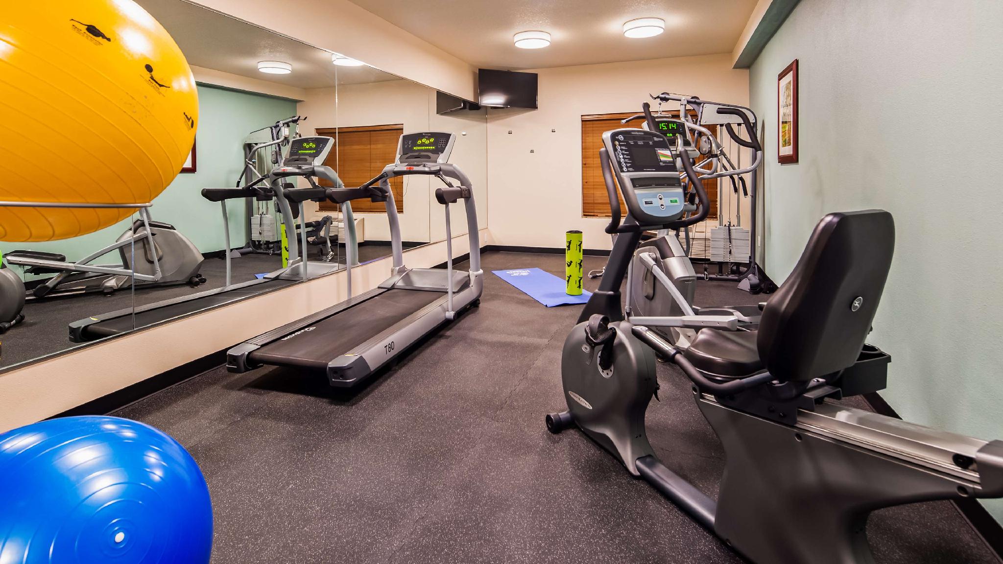 Fitness center with treadmill and stationary bike trainer