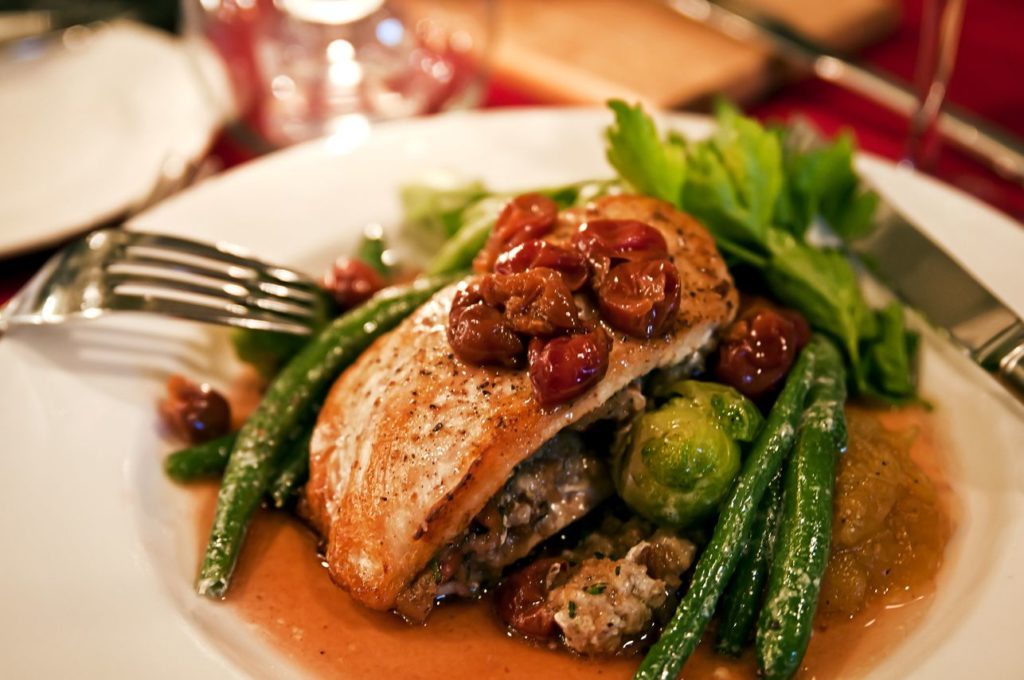 bake salmon over potatoes and green beans in delicate sauce 