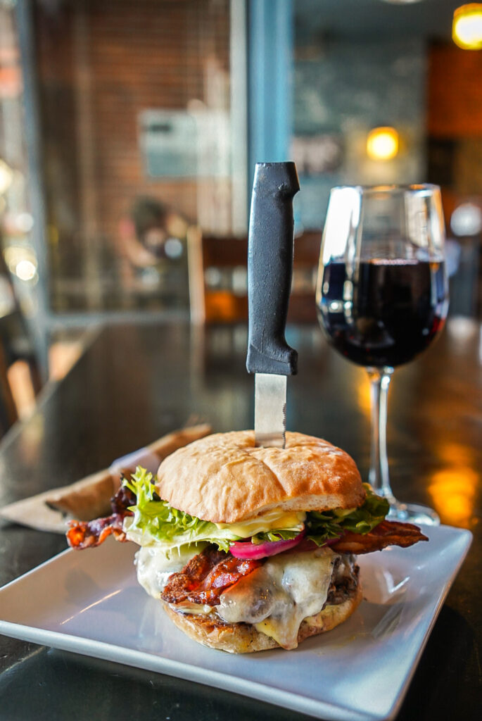 hearty burger and red wine