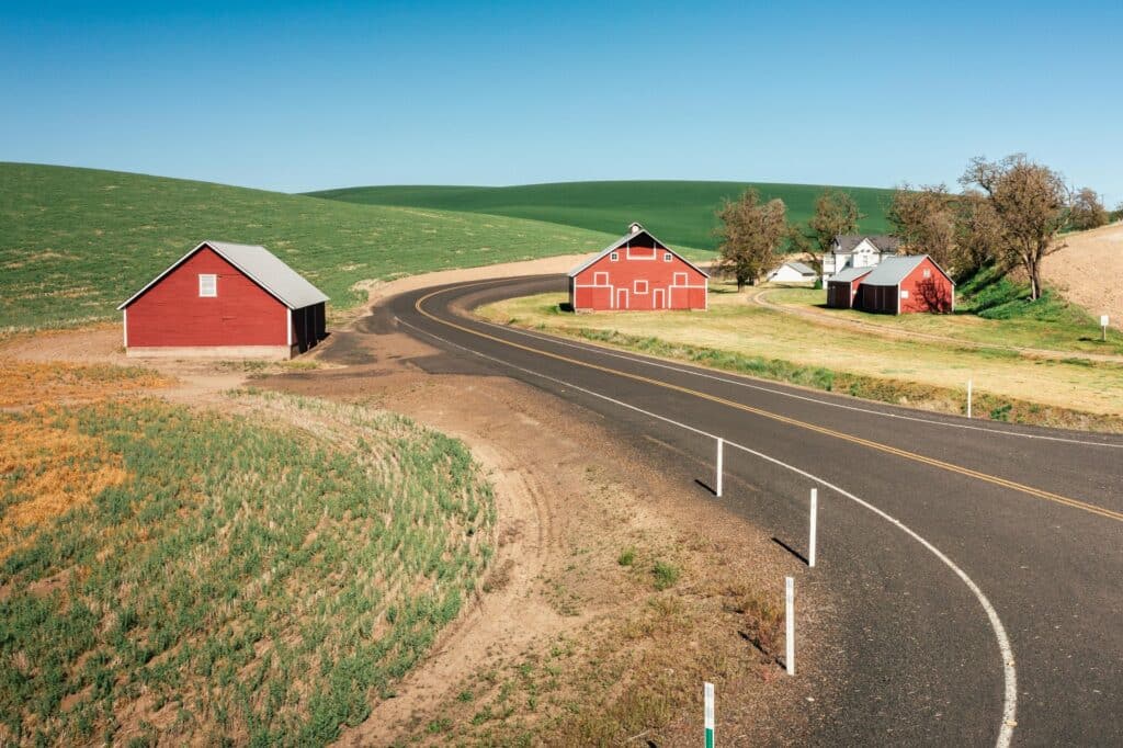 Red barns and road