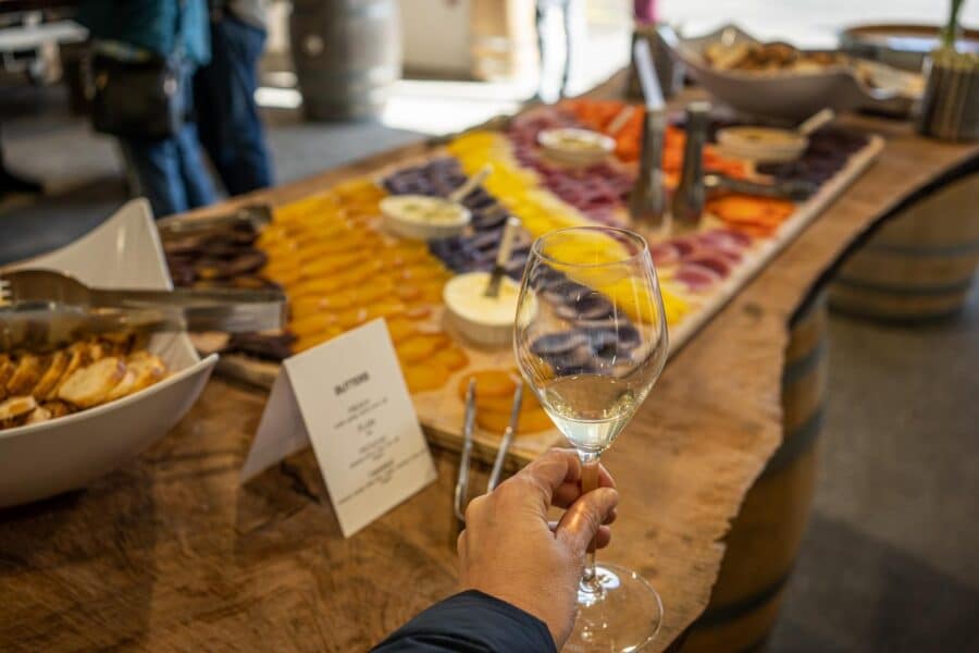 Spring Kick-off Weekend - white wine by a charcuterie board