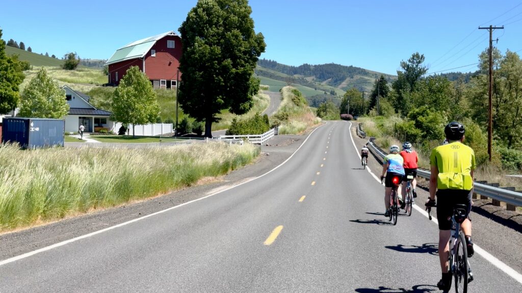 Bike Camp Walla Walla riding toward red barn